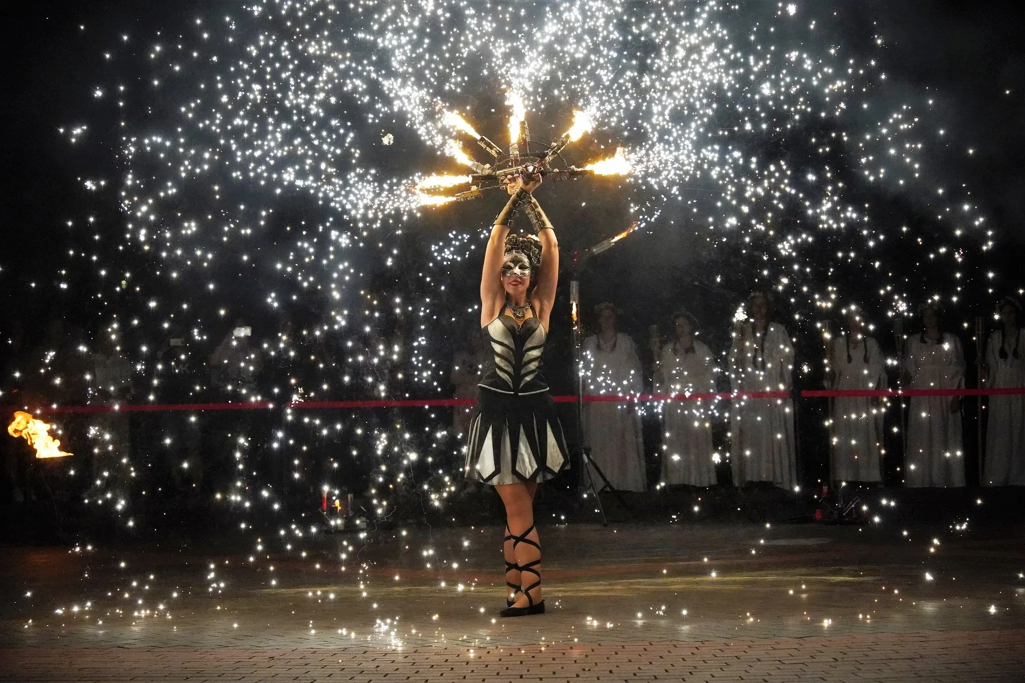 Performer with pyrotechnic fans