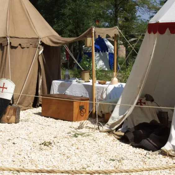 Authentic canvas tents furnished with a table, pottery and a wooden chest