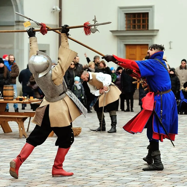 A halberd duel in a city square, spectators watching close by
