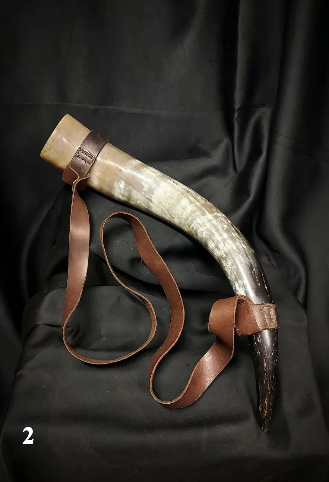 Drinking horn with a leather shoulder strap
