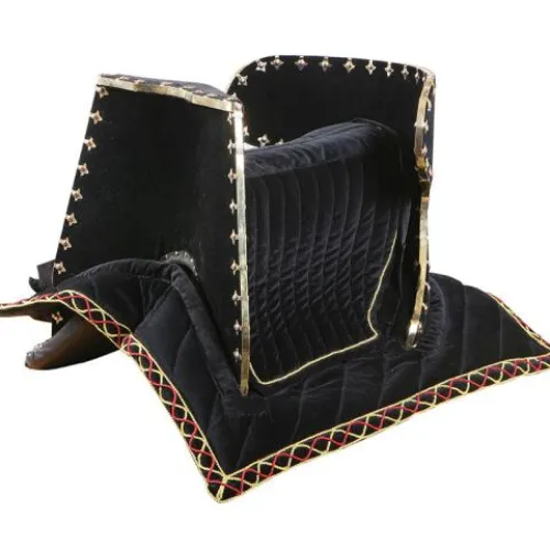 A black horse saddle with gold embroidery and a padded cushion