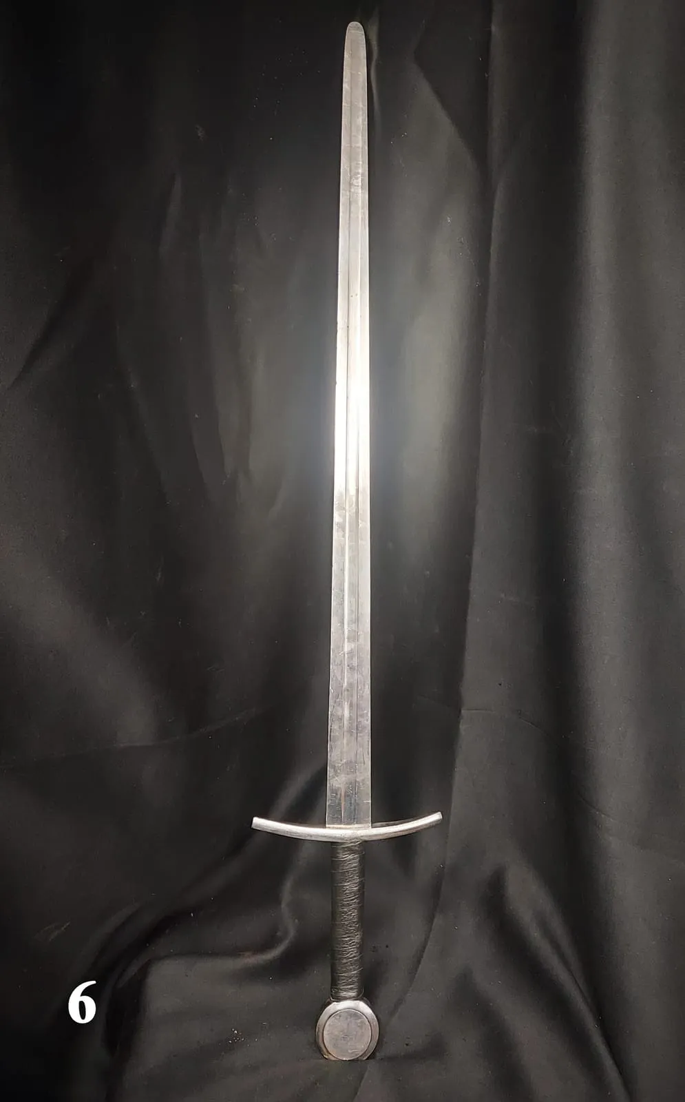 Double-edged knight's sword with a long steel blade