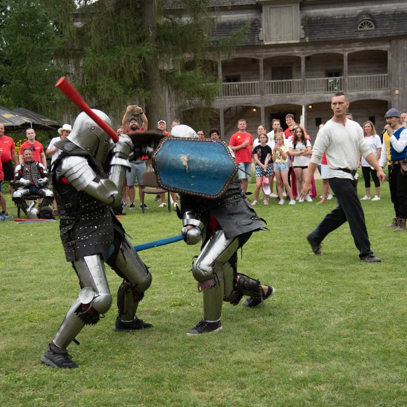 Participants learn sword-fighting technique in an outdoor arena