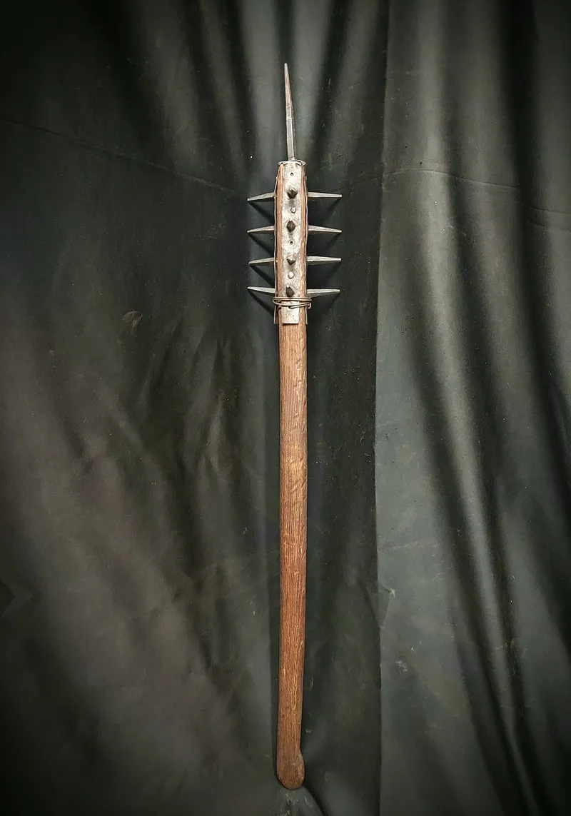 Spiked battle mace on a long wooden shaft