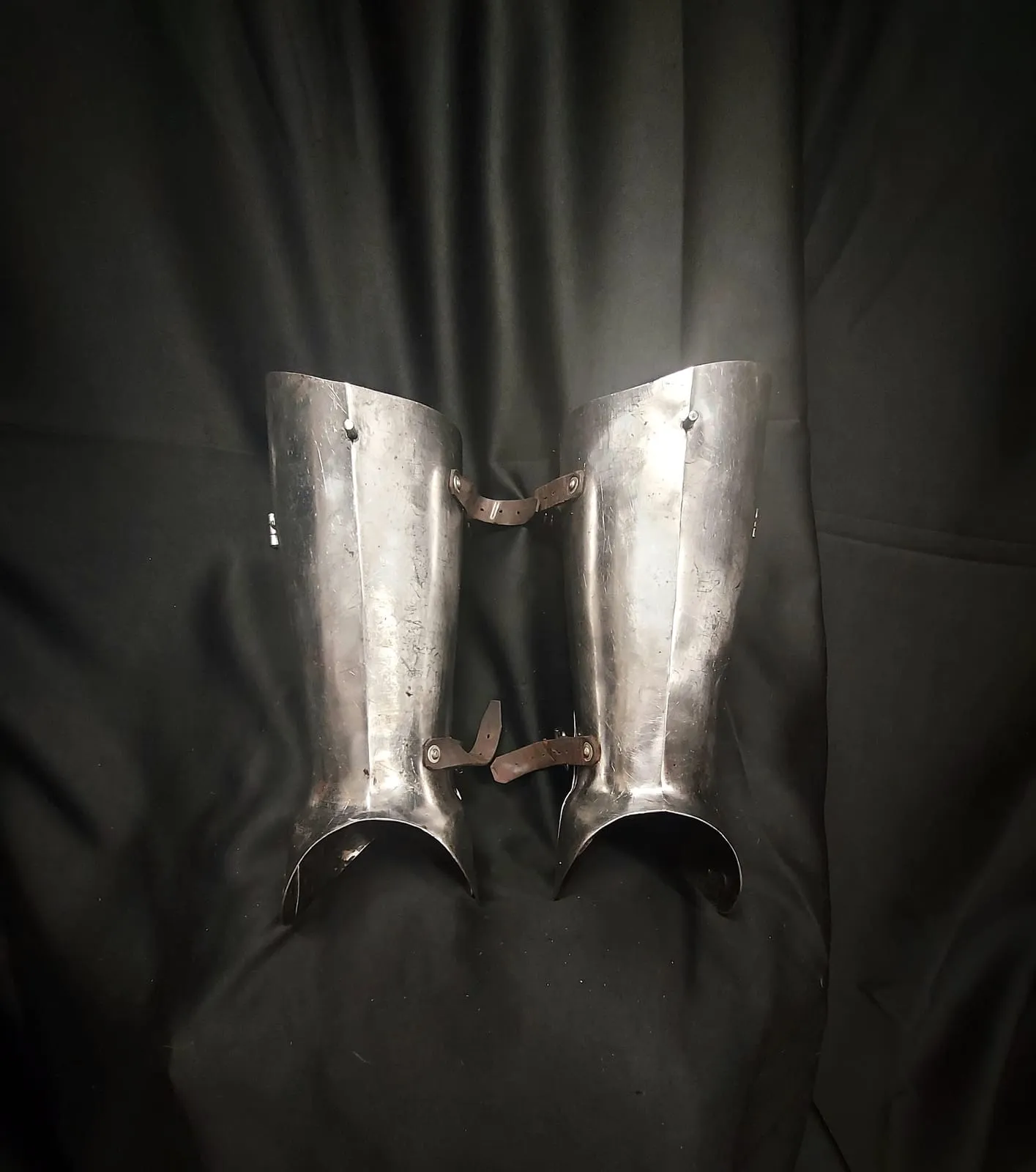 Steel greaves with leather straps