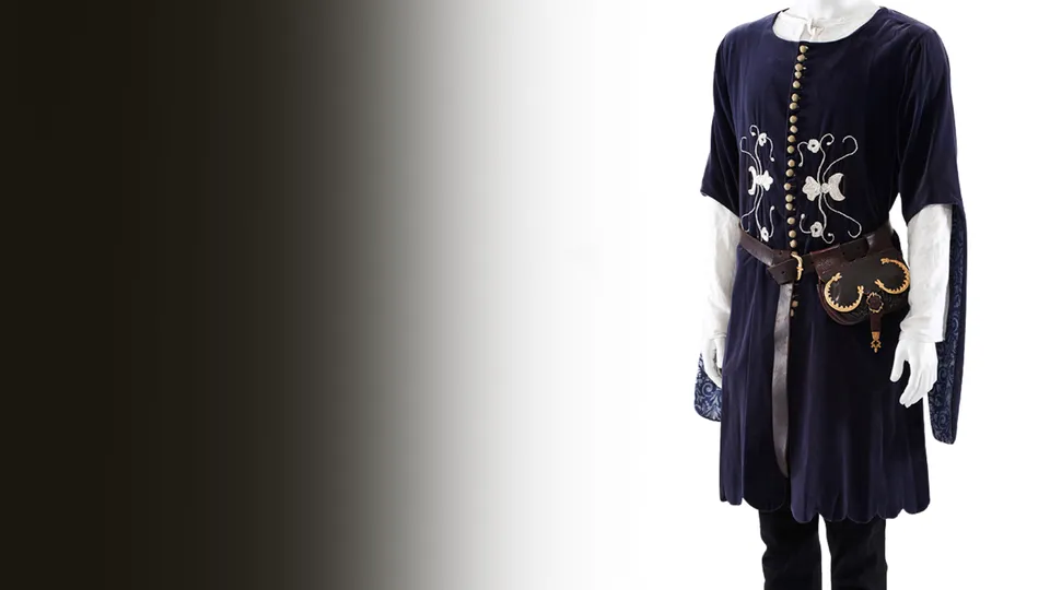A navy medieval tunic with embroidered patterns and a leather belt