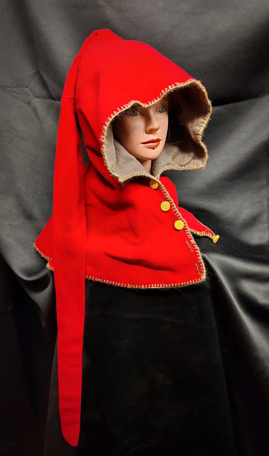Red medieval hood with yellow buttons