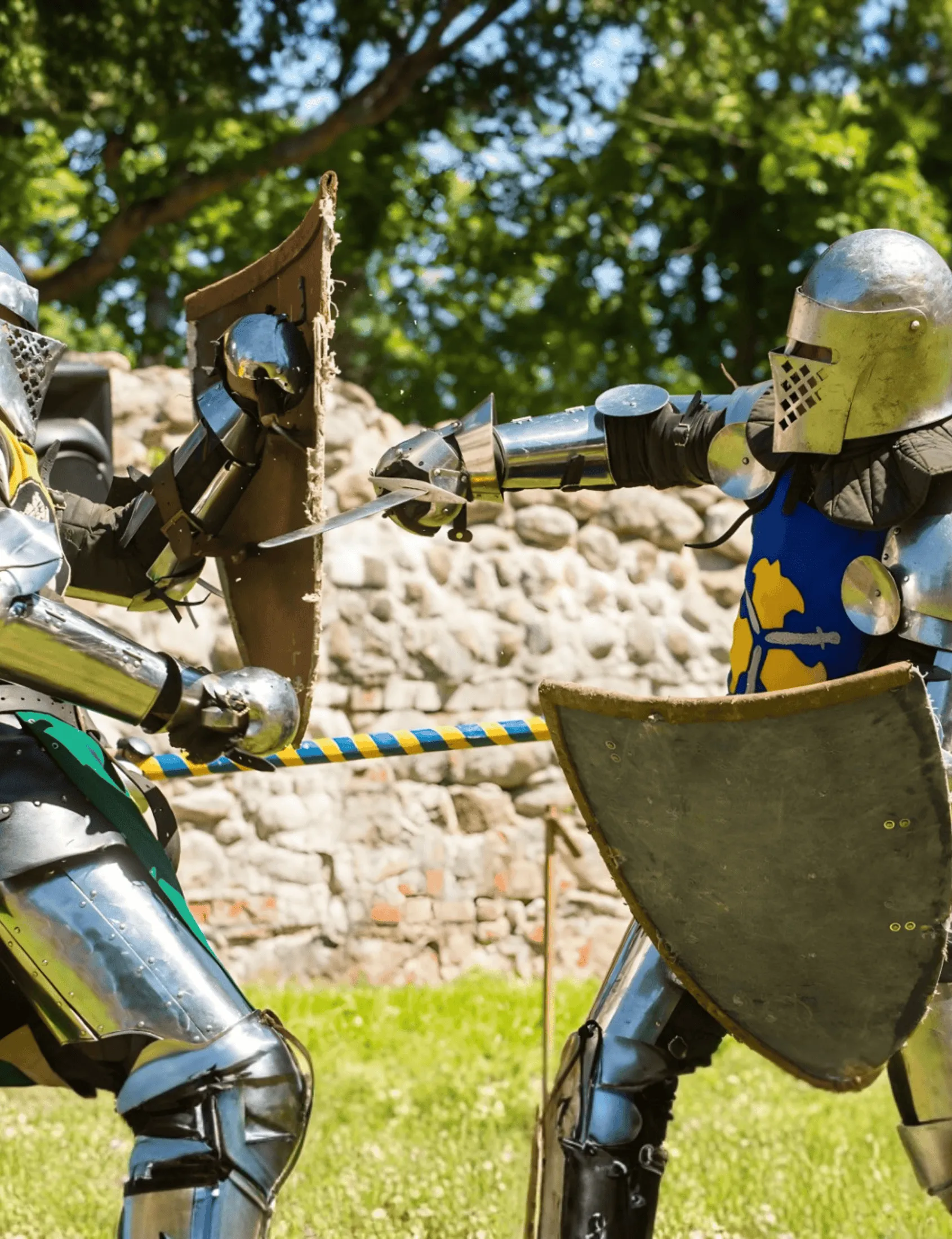 Two knights duel with swords and shields beside a stone castle wall