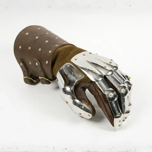 An armored gauntlet with metal plates and a leather lining