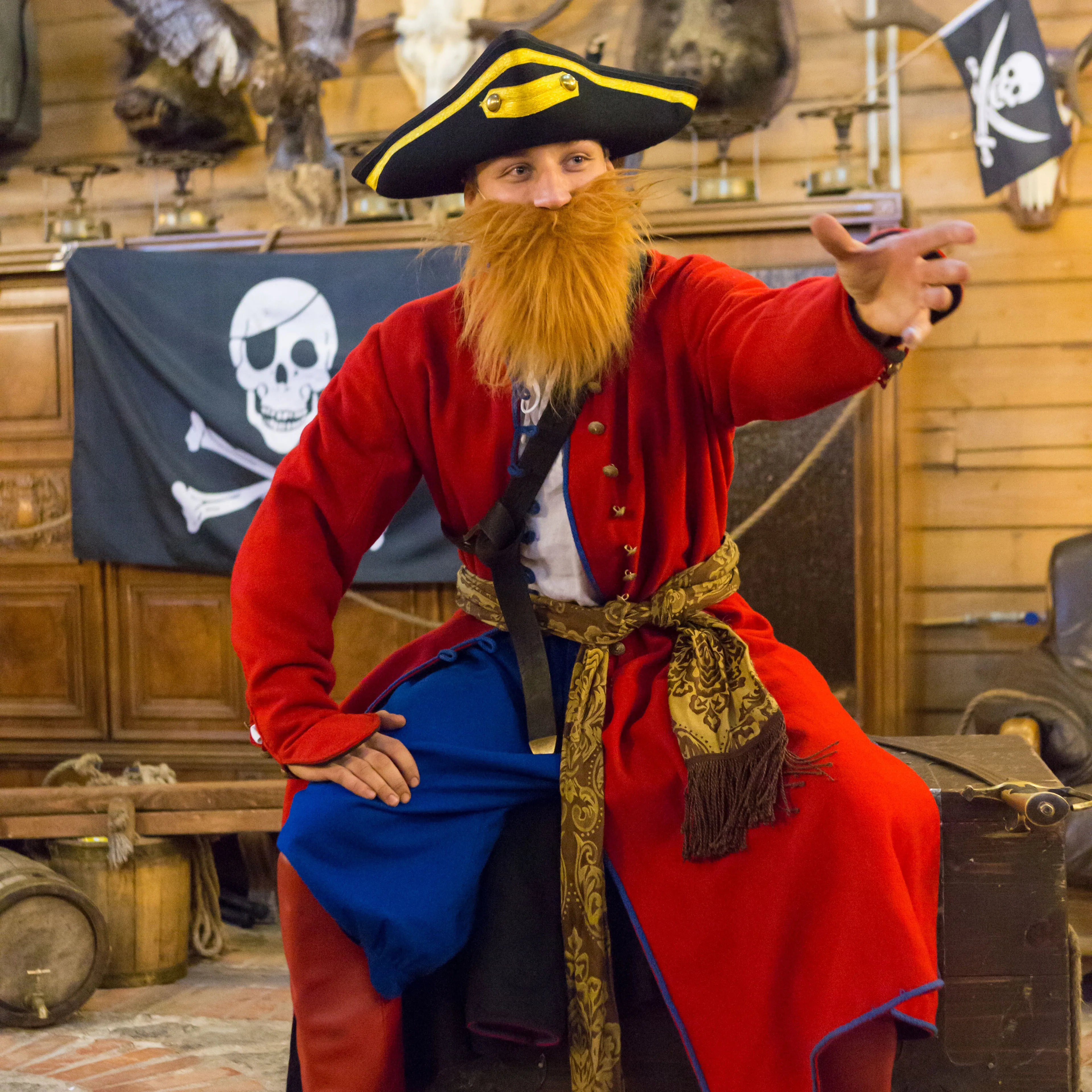 The pirate captain character in a red coat with a long beard