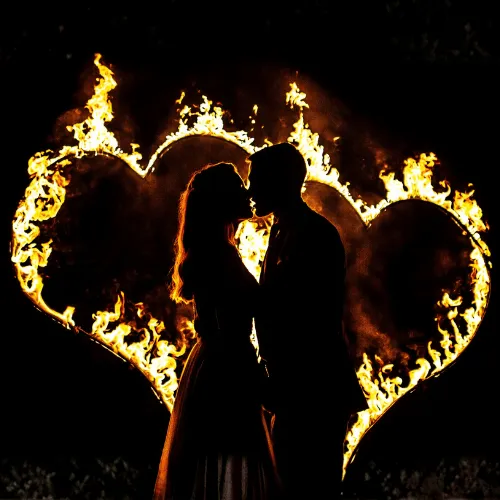 Burning letters SA glowing in the evening darkness