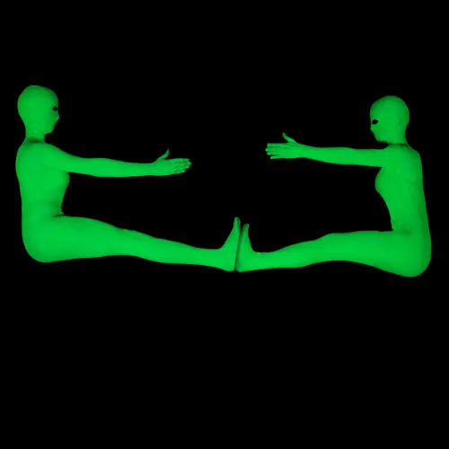 One glowing figure stands upright while another curls up beside it