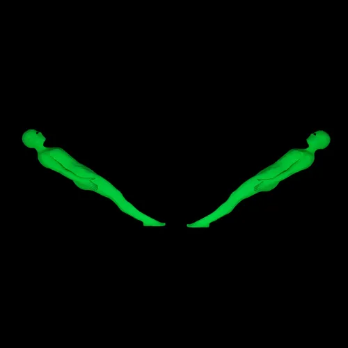Performers lying in a symmetrical pose create a glowing illusion