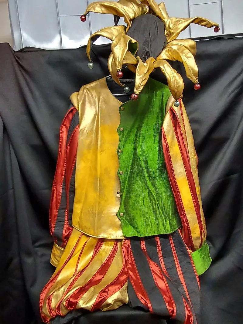 Colourful medieval men's costume in yellow and green