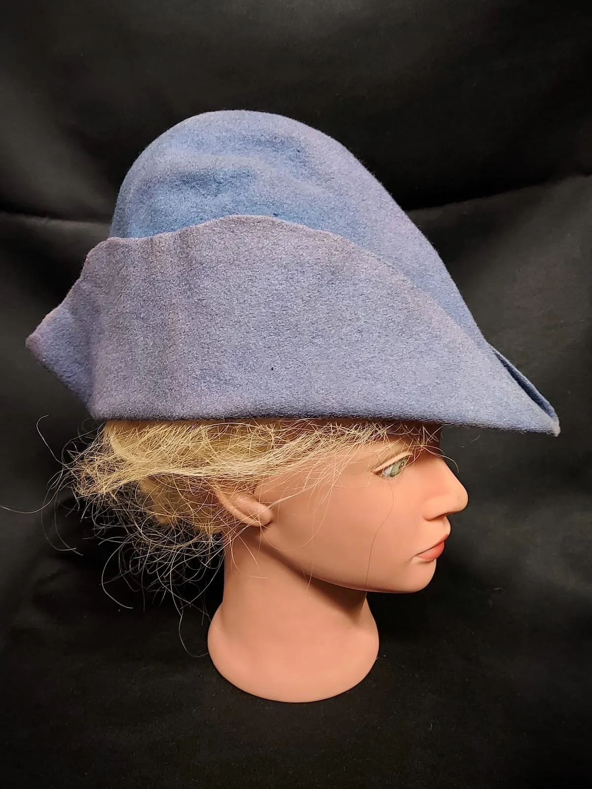 Blue pointed medieval hat on a mannequin