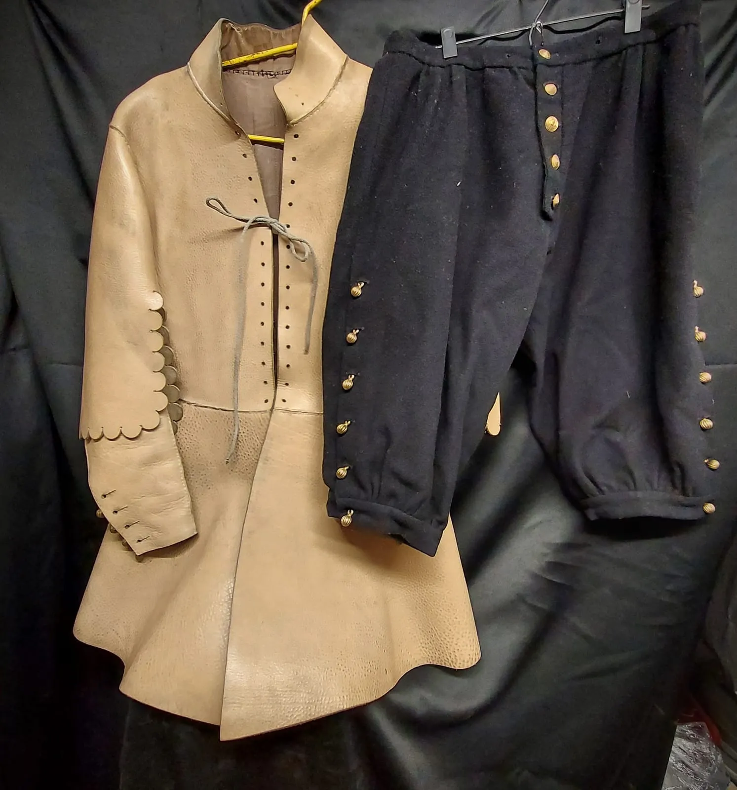 Light 17th-century coat with a dense row of buttons
